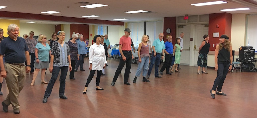 Photo of line dancers learning a new line dance at NVCWDA.